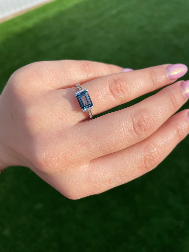 Diamond Emerald Cut East/West Blue Topaz Ring in 14K White Gold